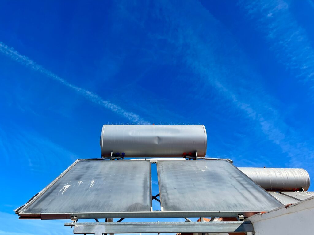 Solar water heater installed on tile roof of house for environmentally